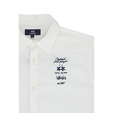 White short-sleeved shirt with a classic collar, button placket, and dark blue 'England polo player' chest embroidery.