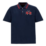 Navy blue pique knit polo shirt with red striped collar, two-button placket, and red embroidered polo players.