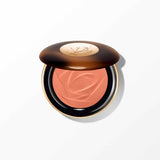 Lancome powder bronzer compact with a dark brown lid, gold-toned accents, and peachy-orange powder with a sculpted rose desig