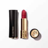 Lancome Drama Matte lipstick in a vibrant red shade, with a matte black and gold-toned casing, and an embossed rose emblem.