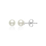 Pair of white spherical pearl stud earrings with silver-toned posts and butterfly backings.