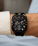 he Police Bullhead watch on a wrist showing the integrated black silicone strap.