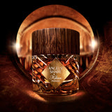 By Kilian Angels Share Paradis perfume bottle with amber liquid, a faceted glass body, a gold-toned diamond label, and a dark