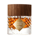 Clear glass perfume bottle with a twisted design, containing amber-coloured liquid, topped with a dark brown wooden cap. A go