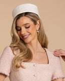 Front view of the Santinni Highgrove earrings showing the gold crystal stud and pearl drop.with model