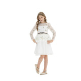 Young girl smiling in a white long-sleeved formal dress with lace bodice, floral embroidery, pleated skirt, and a black ribbon waist belt, standing against a white background.