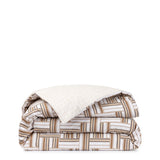 Folded duvet cover set with geometric brown, dark brown, and white interlocking rectangle pattern. Reverse is light beige wit