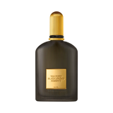 Dark grey translucent glass fragrance bottle with vertical fluting, a gold-toned ridged cap, and a gold rectangular label.