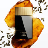 Rectangular black perfume bottle with a gold-toned, vertically ridged cap. Gold 'TOM FORD NOIR EXTREME' text on front.