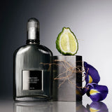 Silver-toned TOM FORD Signature Eau de Grey Vetiver EDT spray bottle with a fluted glass body and ribbed cap.