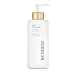 White rectangular body lotion bottle with bevelled edges, a gold-toned collar, and a white pump dispenser.