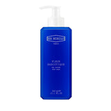 Royal blue rectangular body wash bottle with bevelled edges and a white pump dispenser. Features 'EX NIHILO PARIS' branding.