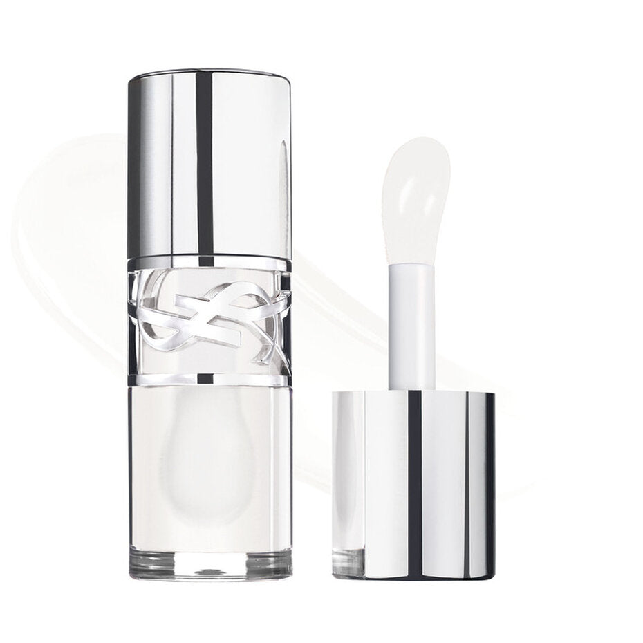 Clear lip gloss tube with silver-toned cap and YSL logo. Translucent white gloss and applicator with a paddle tip.