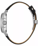 Close-up of a watch with a black strap and silver case 