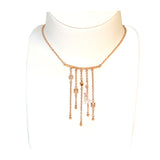 عقد جست كافالي بلون ذهبي وردي مع قلادة طويلة على شكل رأس أفعى وشعار Just Cavalli مع تعليقة قلب مرصعة بالكريستال 