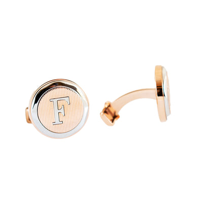   ازرارفري ميلانو  فضي و بلون ذهبي وردي، مع شعار العلامة على الواجهة